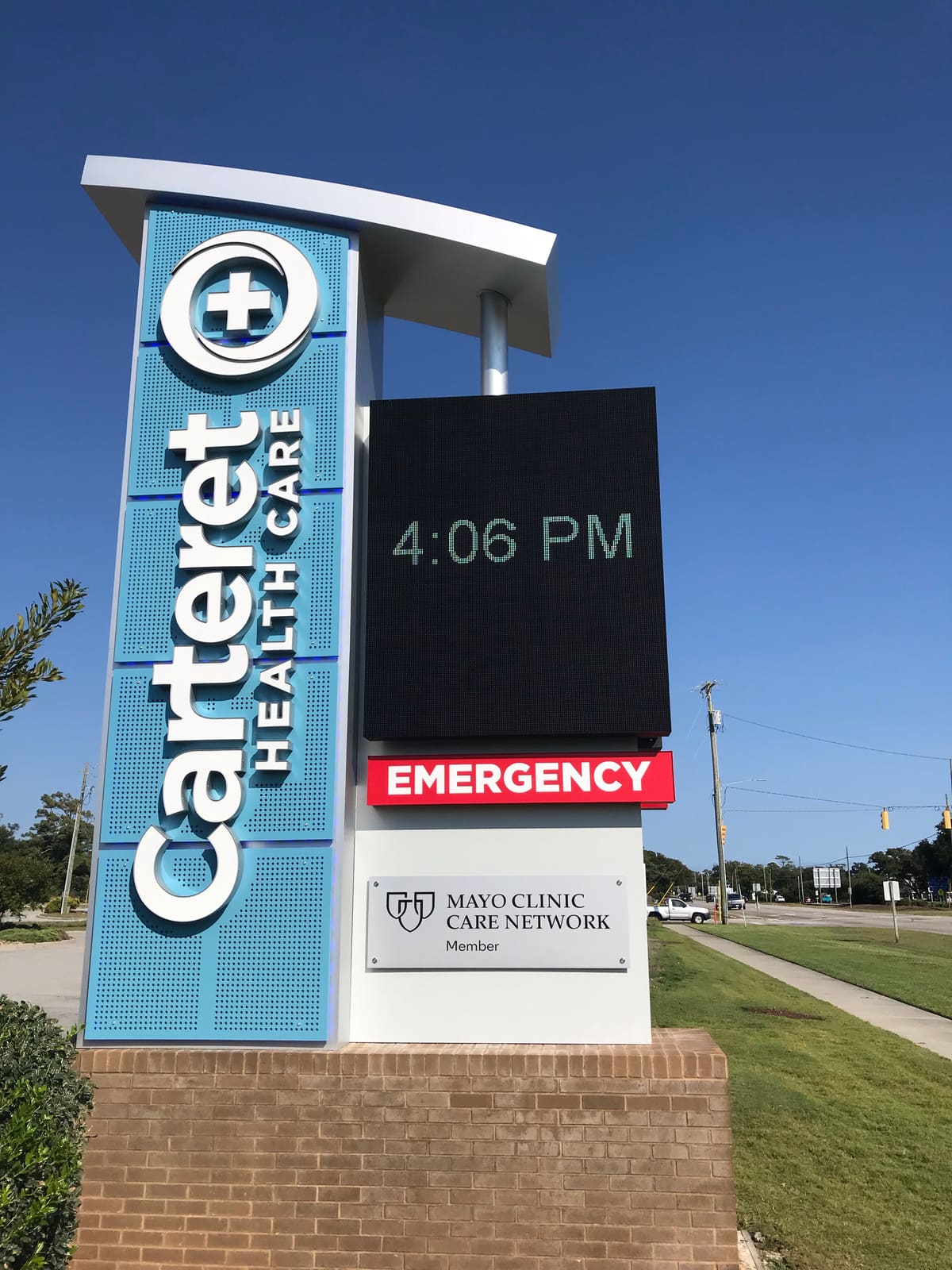 Carteret Health Care tower monument with LED board and Mayo Clinic Care Network plaque